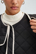 QUILTED BLACK JACKET WITH CONTRAST PIPING